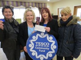 Presentation of cheque for €476.00 from tesco, proceeds of the blue chip community fund
