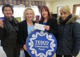 Presentation of cheque for €476.00 from tesco, proceeds of the blue chip community fund